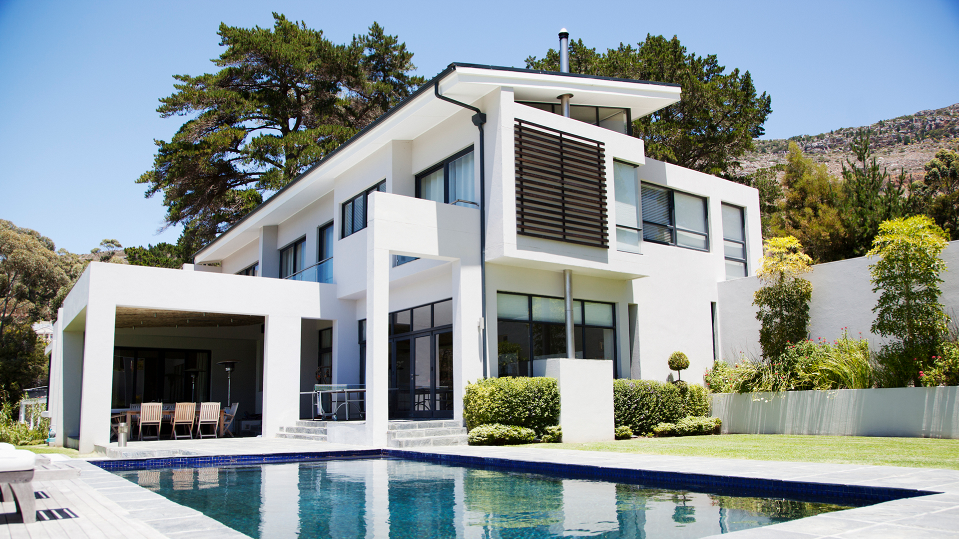 Modern white two-story house with pool